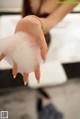 A woman is washing her hands with foam. 